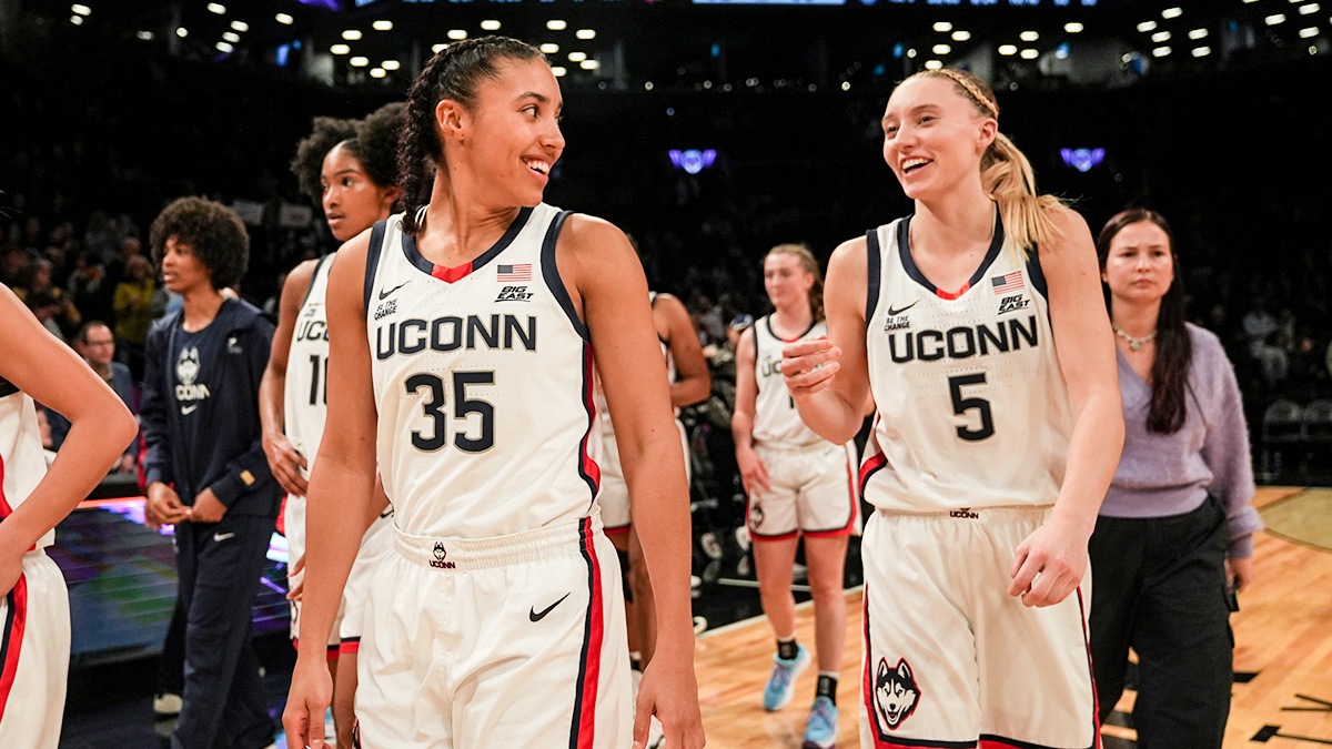 Connecticut Huskies running back Azzi Fad (35) and Connecticut Huskies running back Paige Bookers (5) celebrate after the game against the Louisville Cardinals at Barclays Center. 