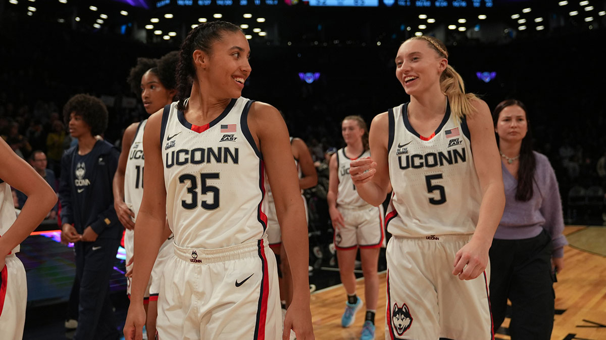 Connecticut Huskies guard Azzi Fudd (35) and Connecticut Huskies guard Paige Bueckers (5) celebrate after the game against the Louisville Cardinals.