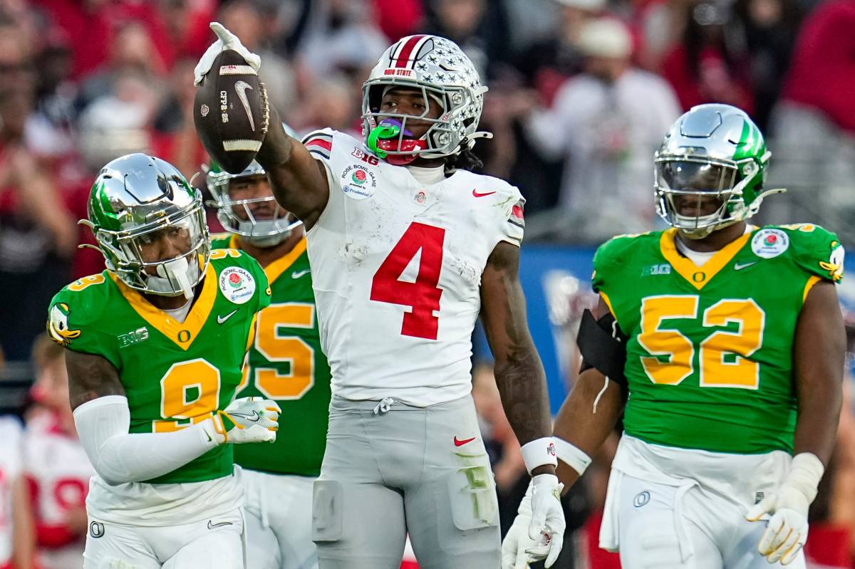 Ohio State Buckeyes wide receiver Jeremiah Smith (4) celebrates a first down catch during the second half of the College Football Playoff quarterfinal against the Oregon Ducks at the Rose Bowl