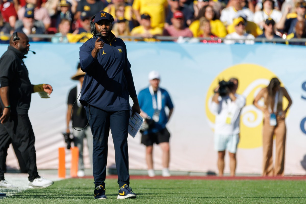 Michigan Wolverines head coach Sherrone Moore gestures from the field against the Alabama Crimson Tide during the second half at Raymond James Stadium.