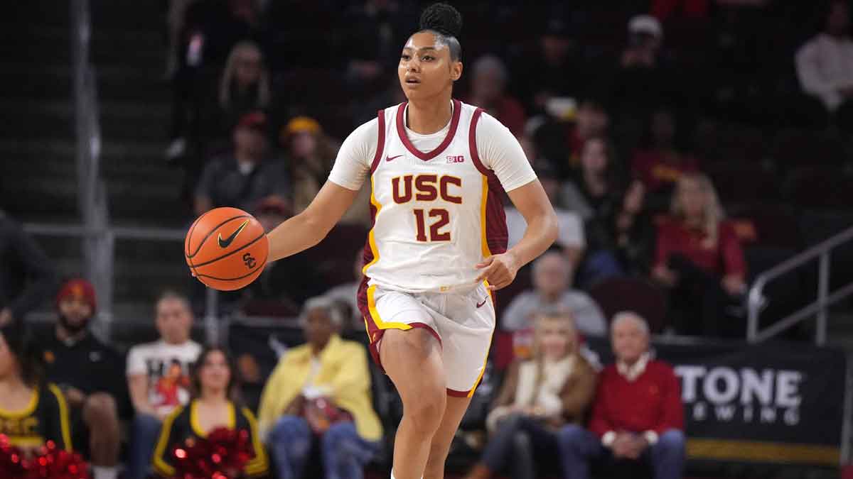 Southern California Trojans guard JuJu Watkins (12) dribbles the ball against the Michigan Wolverines in the first half.