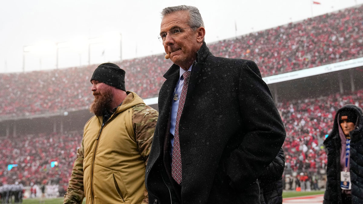Former Ohio State football and Florida football coach Urban Meyer walks across the field during the NCAA football game against the Indiana Hoosiers at Ohio Stadium in Columbus on Monday, Nov. 25, 2024. Ohio State won 38-15.