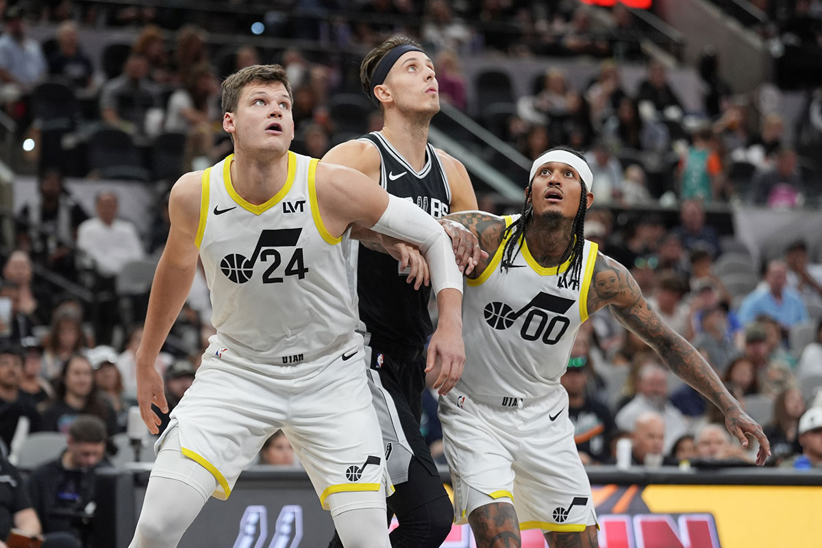 Utah Jazz center Walker Kessler (24) and guard Jordan Clarkson (00) block San Antonio Spurs forward Zach Collins (23) in the second half at Frost Bank Center. 