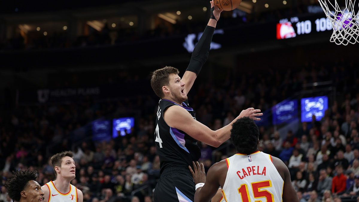 Utah Jazz center Walker Kessler (24) shoots the ball over Atlanta Hawks center Clint Capela (15) during the second half at Delta Center.