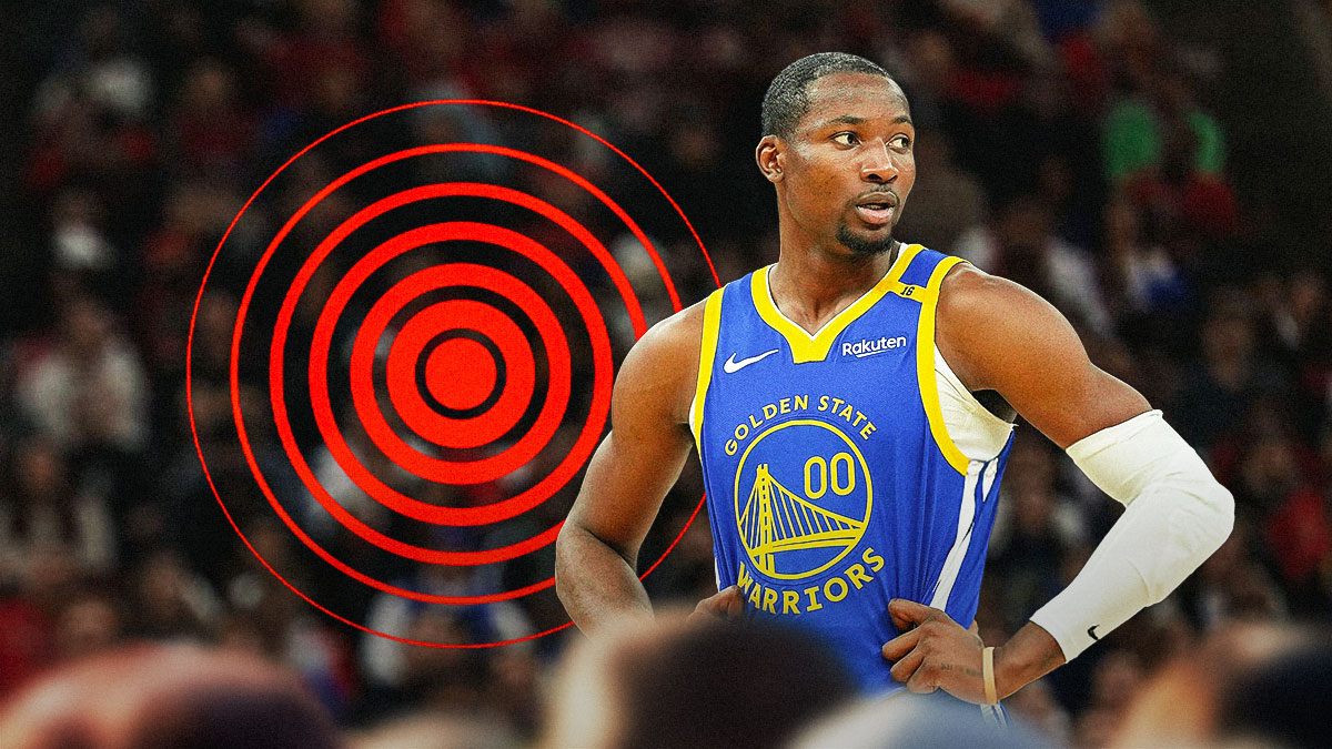 Jonathan Kuminga (Warriors) looking serious and with pain symbol int he background