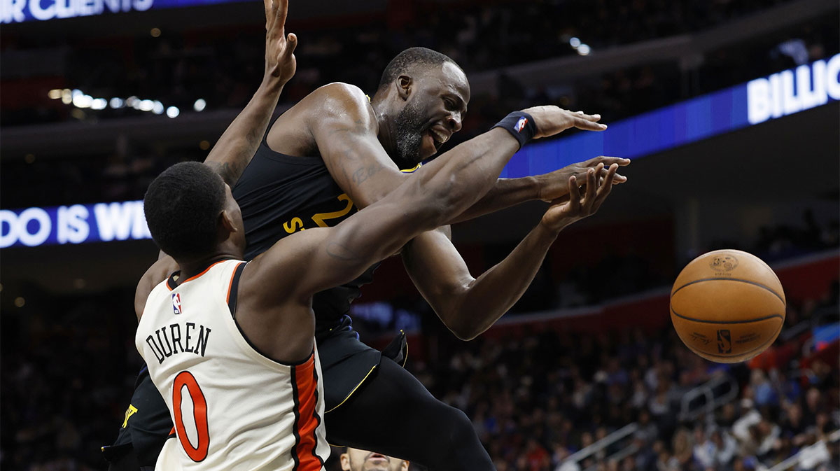 Warriors forward Draymond Green (23) is fouled by Detroit Pistons center Jalen Duren (0) in the second half at Little Caesars Arena