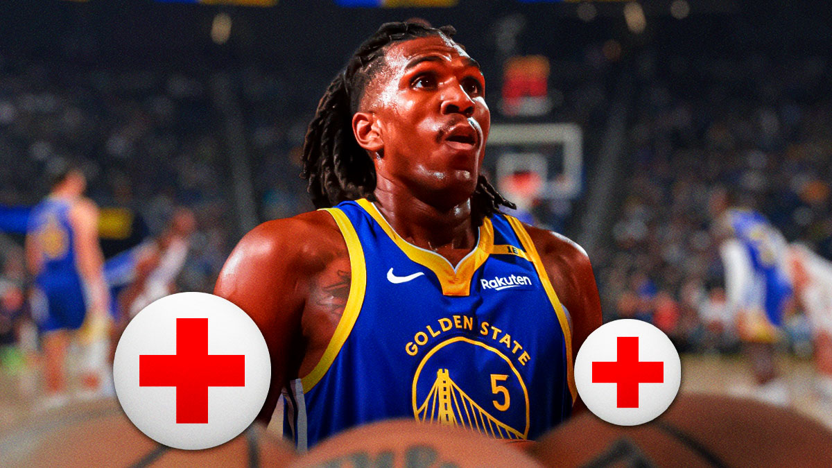 Kevon Looney in Warriors gear with medical alert.