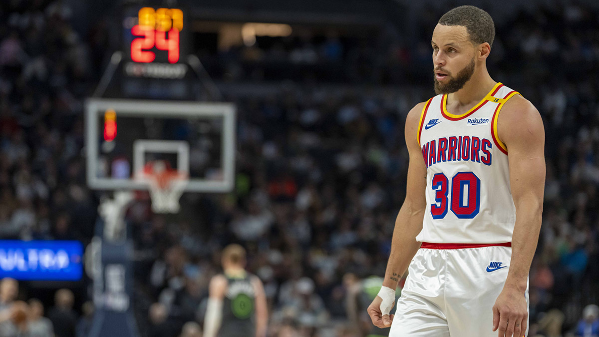 Warriors guard Stephen Curry (30) watches against the Minnesota Timberwolves during the second half at Target Center