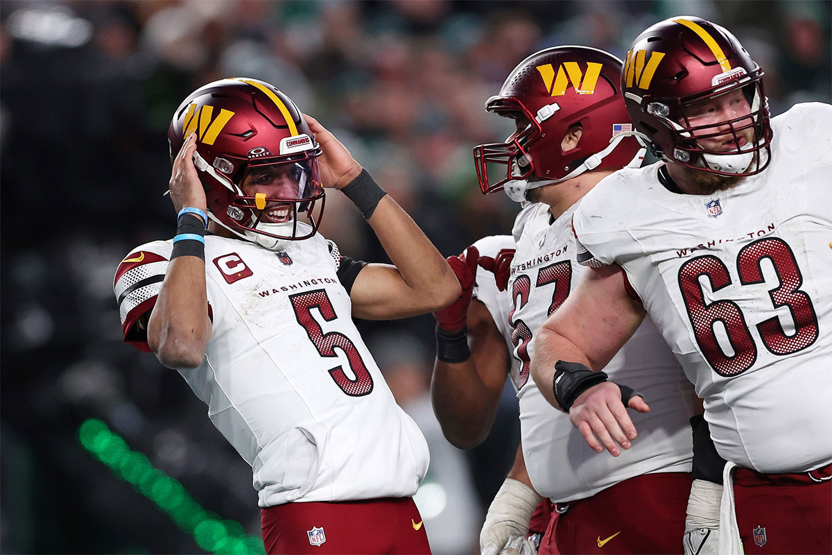 Washington Commanders quarterback Jayden Daniels (5) celebrates after a play against the Philadelphia Eagles during the second half in the NFC Championship game at Lincoln Financial Field.