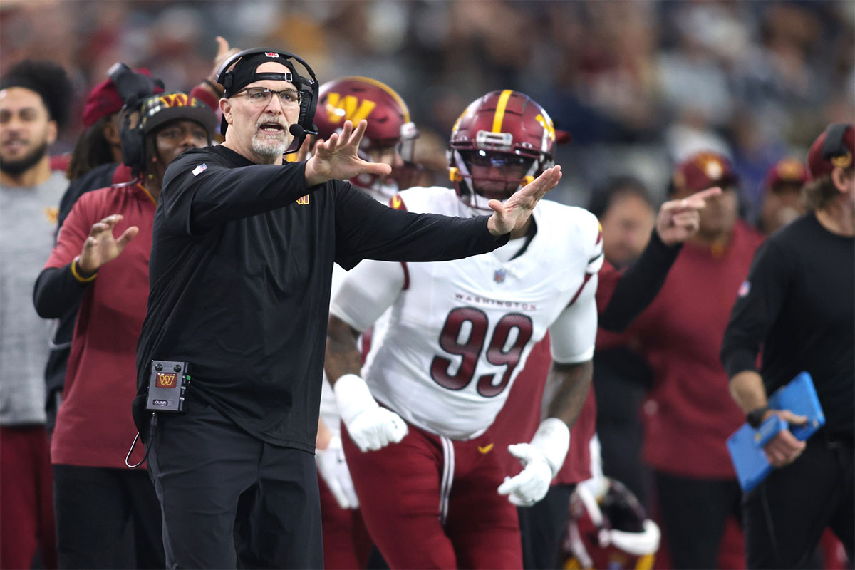 Washington Commanders head coach Dan Quinn calls a play against the Dallas Cowboys during the first quarter at AT&T Stadium.