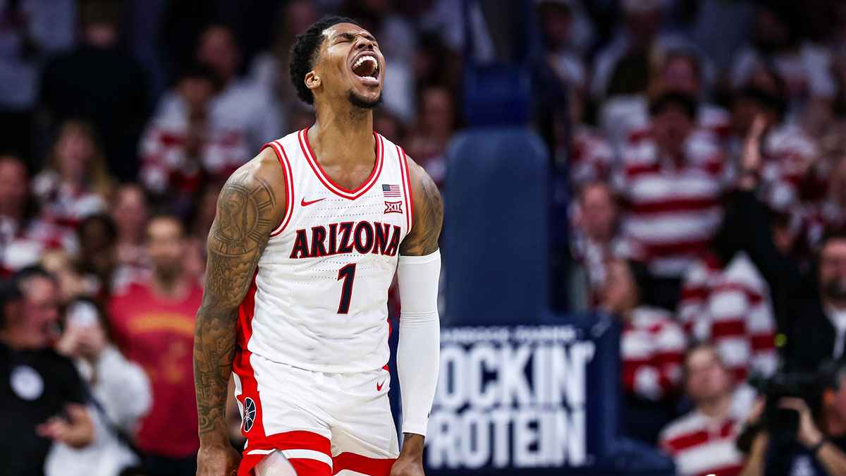 Arizona Wildcats guard Caleb Love (1) celebrates a dunk he made during the first half against the Iowa State Cyclones at McKale Center.