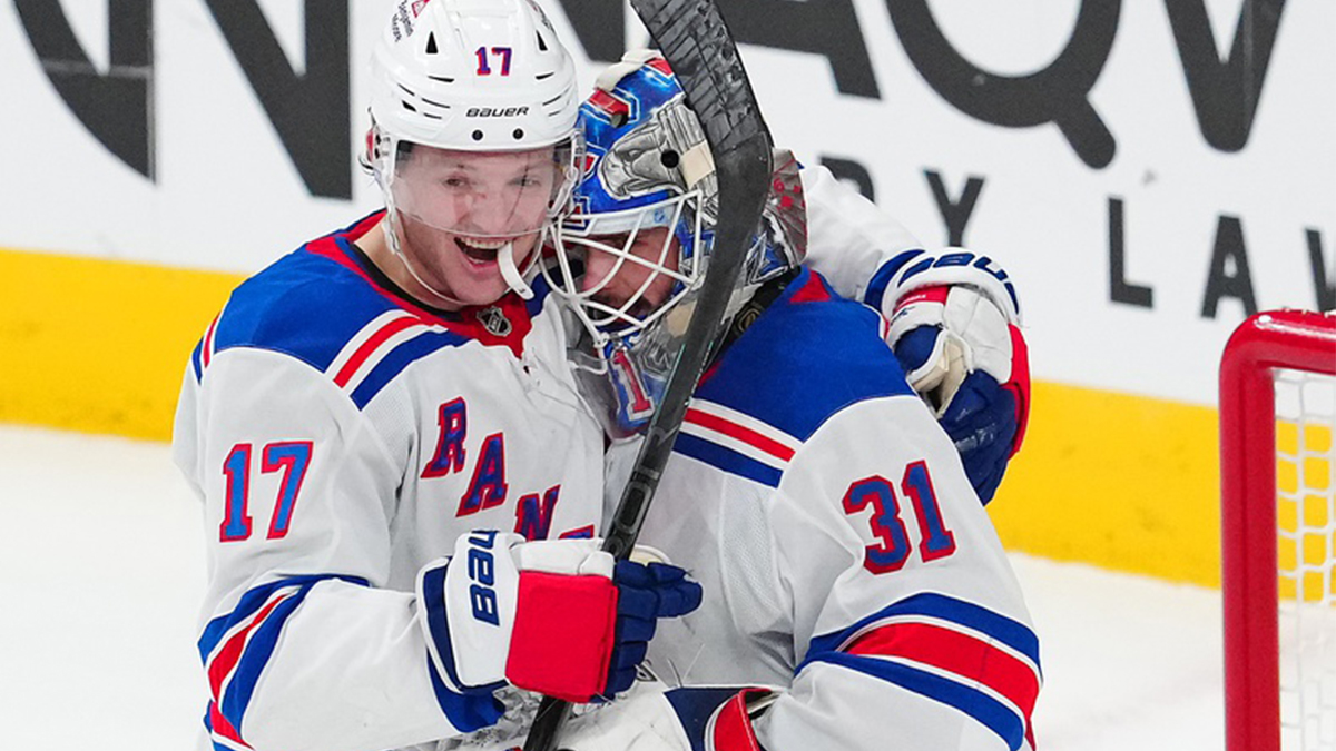 New York Rangers goaltender Igor Shesterkin (31) is congratulated by New York Rangers defenseman Will Borgen (17) after the Rangers defeated the Vegas Golden Knights at T-Mobile Arena.