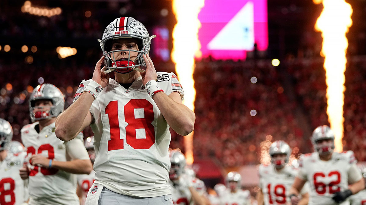 Ohio State Buckeyes quarterback Will Howard (18) take the field for the start of the game against Notre Dame Fighting Irish during the College Football Playoff National Championship at Mercedes-Benz Stadium.
