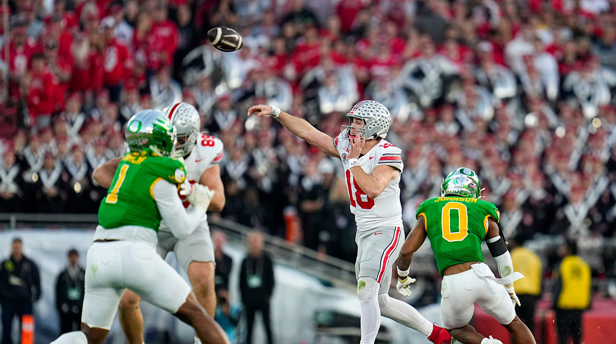 Ohio State Buckeyes quarterback Will Howard (18) throws a pass during the second half of the College Football Playoff quarterfinal against the Oregon Ducks at the Rose Bowl