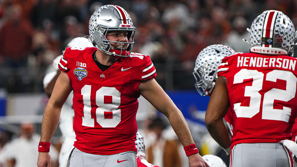 Ohio State quarterback Will Howard (18) yells instructions to his team during the College Football Playoff semifinal game against the Texas Longhorns in the Cotton Bowl at AT&T Stadium