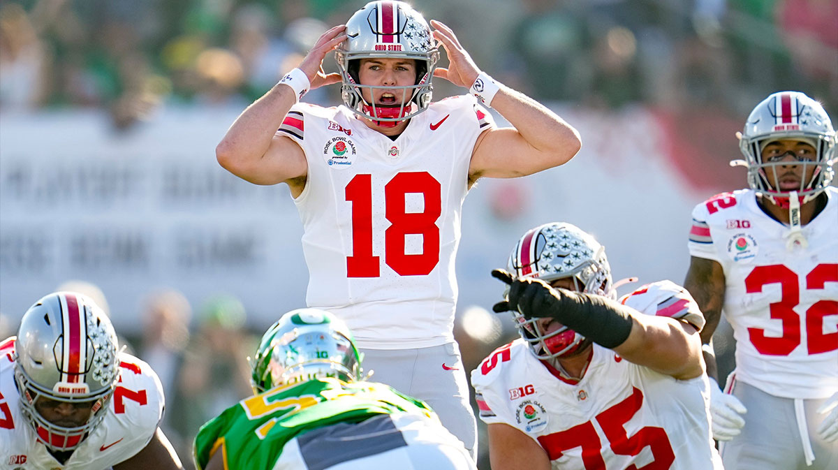Ohio State Buckeyes quarterback Will Howard (18) motions at the line of scrimmage during the College Football Playoff quarterfinal against the Oregon Ducks at the Rose Bowl