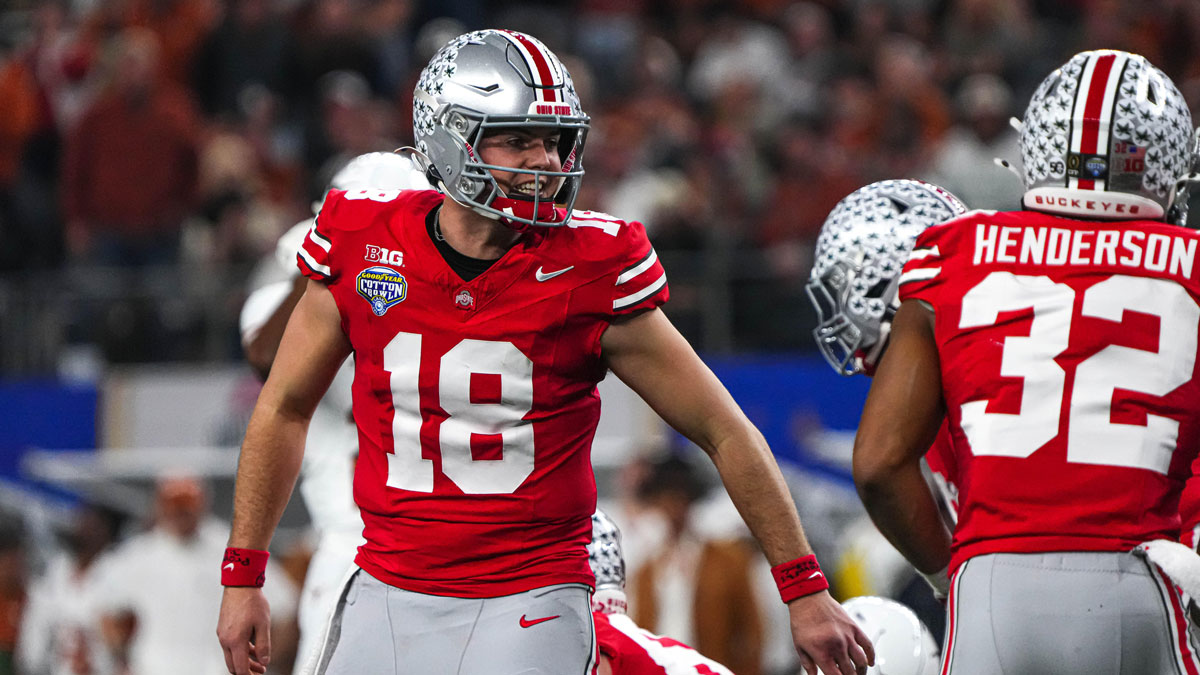 Ohio State quarterback Will Howard (18) yells instructions to his team during the College Football Playoff semifinal game against the Texas Longhorns in the Cotton Bowl at AT&T Stadium