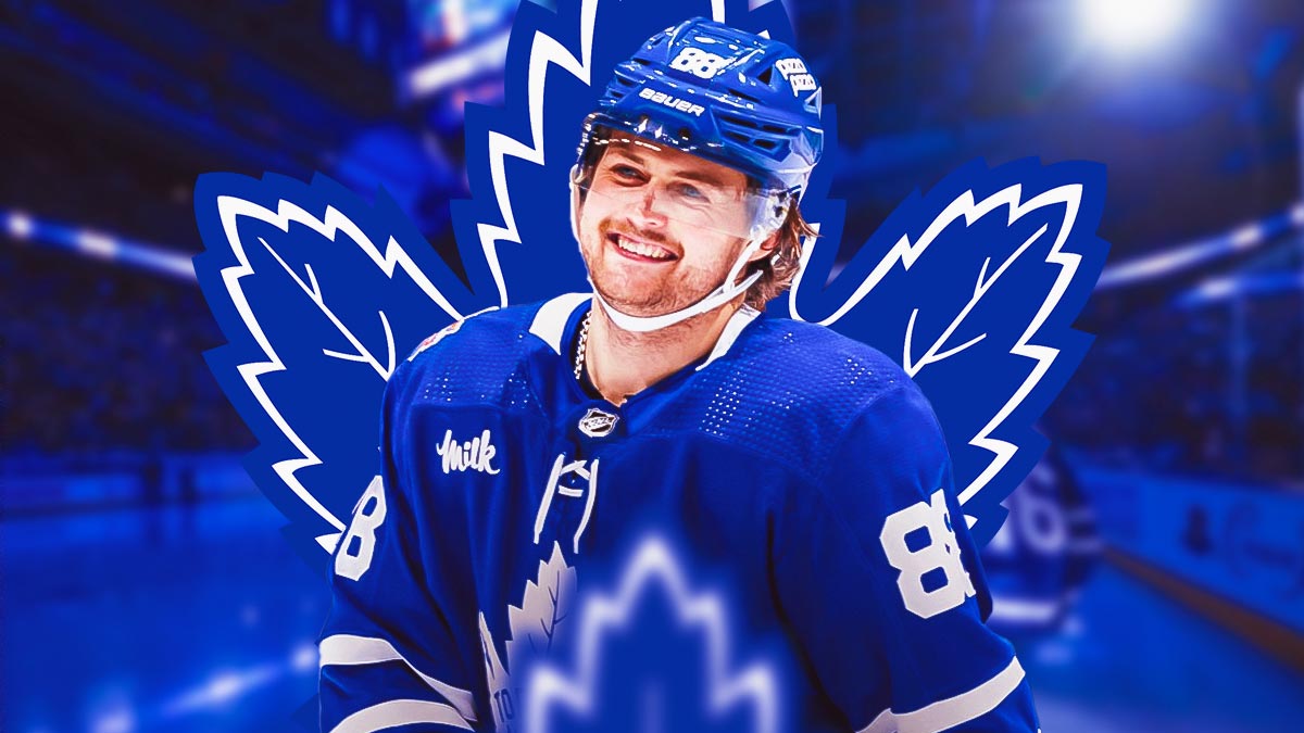 William Nylander smiling. Maple Leafs logo in the background.
