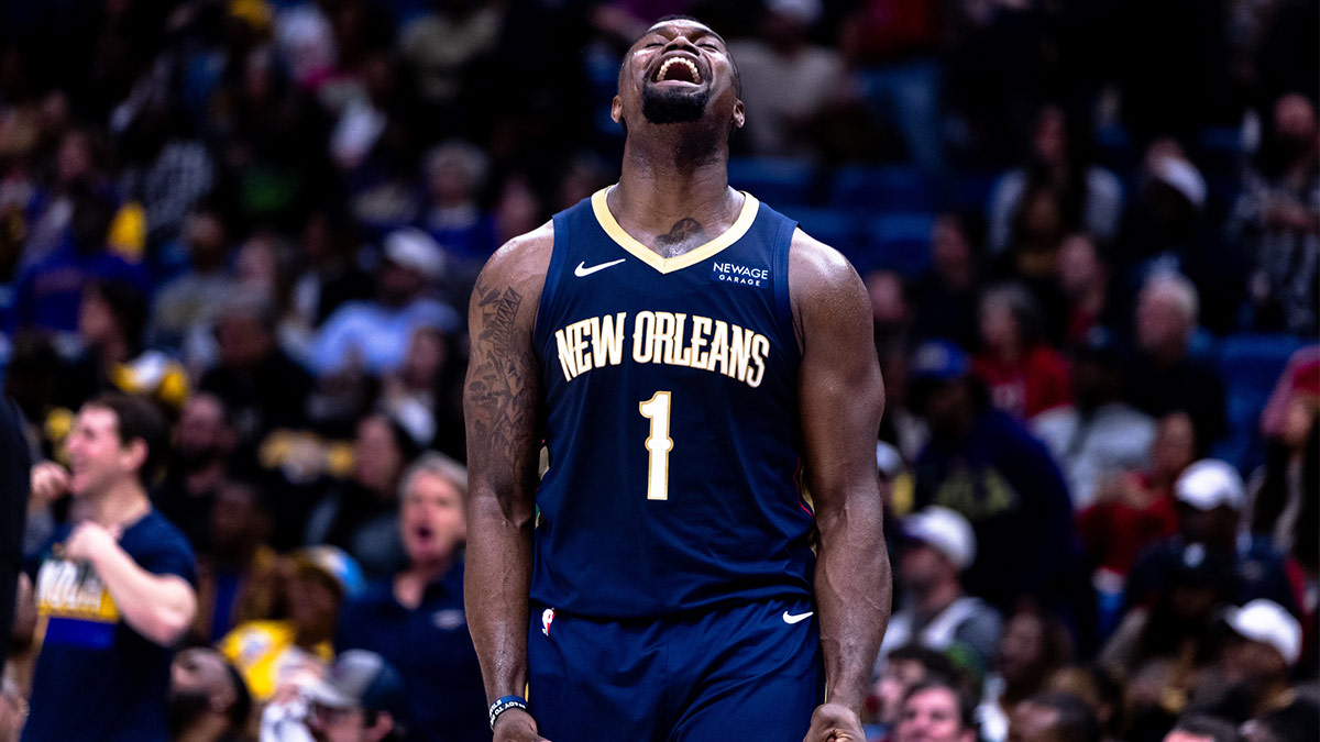 New Orleans Pelicans forward Zion Williamson (1) reacts to dunk the ball through the arm of Utah Jazz forward Drew Eubanks (15) during the second half at the Smoothie King Center.