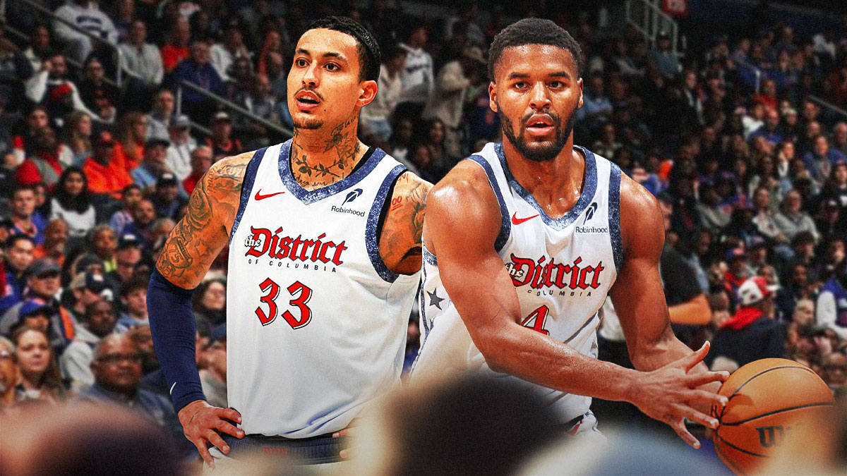 Kyle Kuzma and Jared Butler smile next to each in Wizards gear. Butler holding basketball