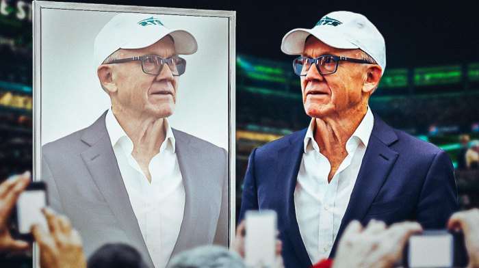 Woody Johnson looks at mirror sadly