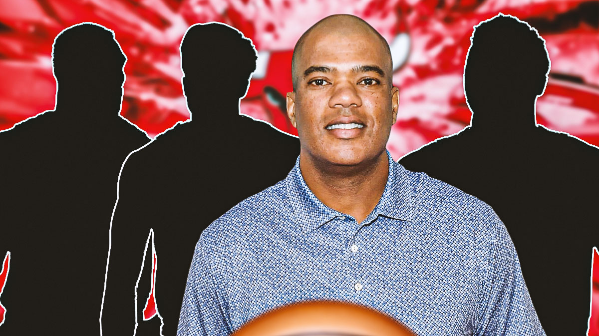 GM Marc Eversley in the middle - Three mystery players beside him - Chicago Bulls wallpaper in the background