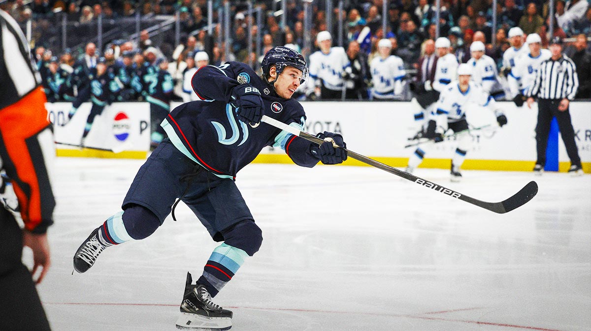 Seattle Kraken center Yanni Gourde (37) shoots the puck against the Utah Hockey Club during the third period at Climate Pledge Arena