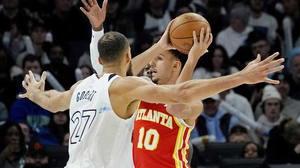 Atlanta Havks Prom Zaharie Risacher (10) were surrounded by Minnesota Timbervolves Center Rudi Gbert (27) in the third quarter in the target center. 