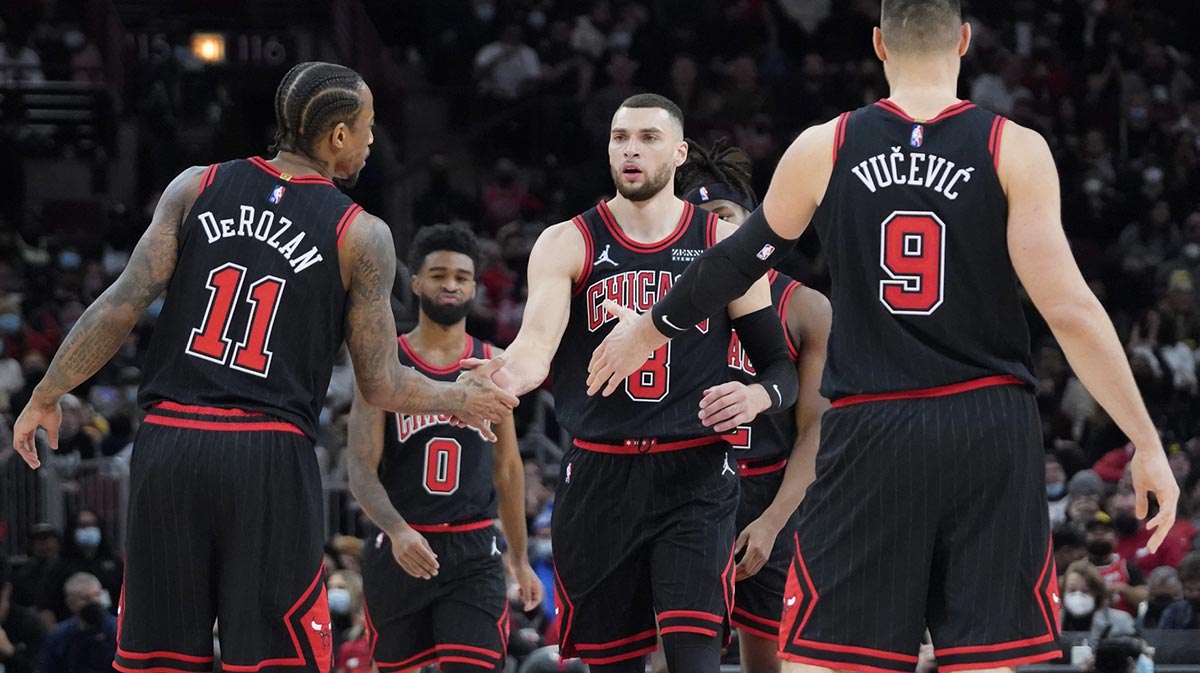 Chicago Bull Guard Zach Lavina (8) celebrates a three-point basket against Indiana Pacer with Demara Derozan (11) and Nikola Vučević (9) during the second half in the United Center.