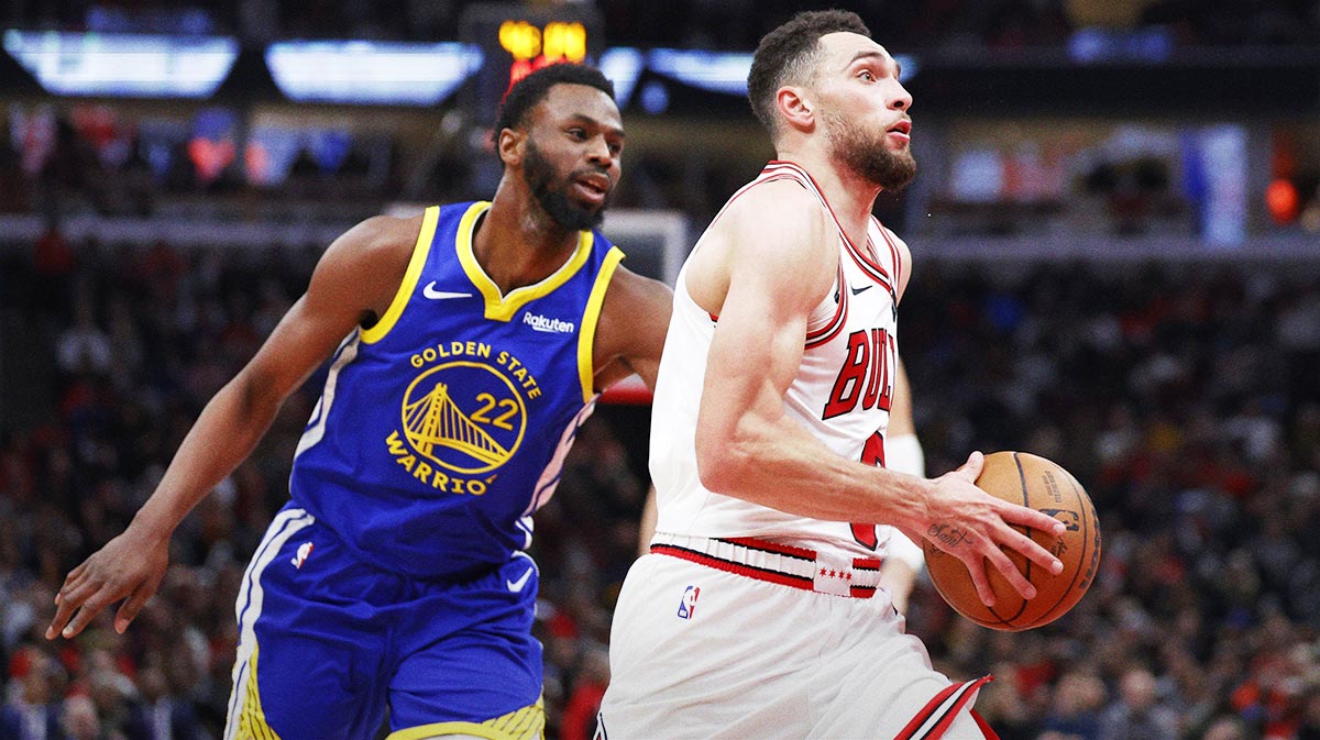 Chicago Bulls guard Zach LaVine (8) drives against Golden State Warriors forward Andrew Wiggins (22) during the second half at United Center.