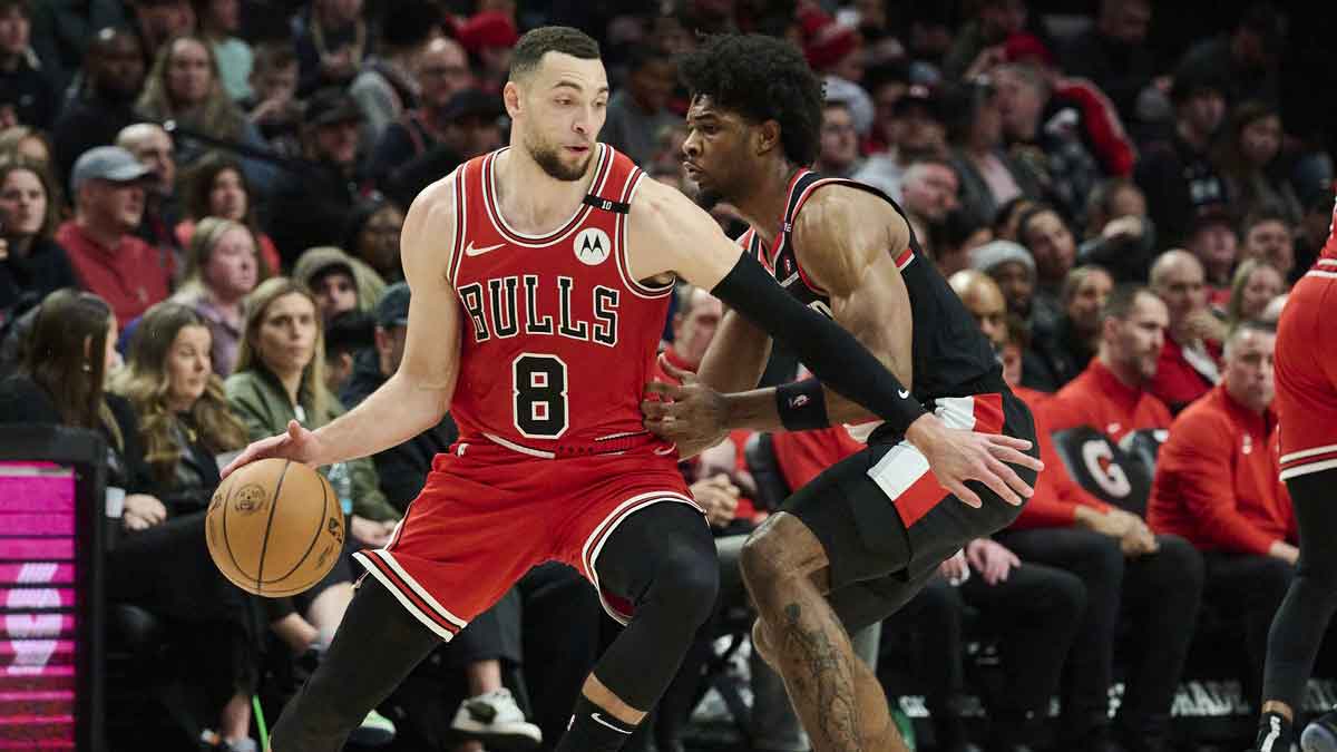 Chicago Bulls guard Zach LaVine (8) dribbles the ball during the second half against Portland Trail Blazers guard Scoot Henderson (00) at Moda Center.