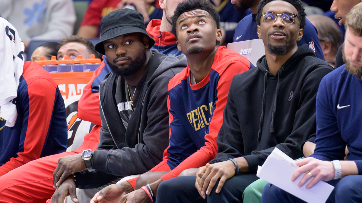 New Orleans Pelicans forward Zion Williamson, left, center Yves Missy and forward Herbert Jones (2) watch from the bench during the second half against the Dallas Mavericks at the Smoothie King Center.