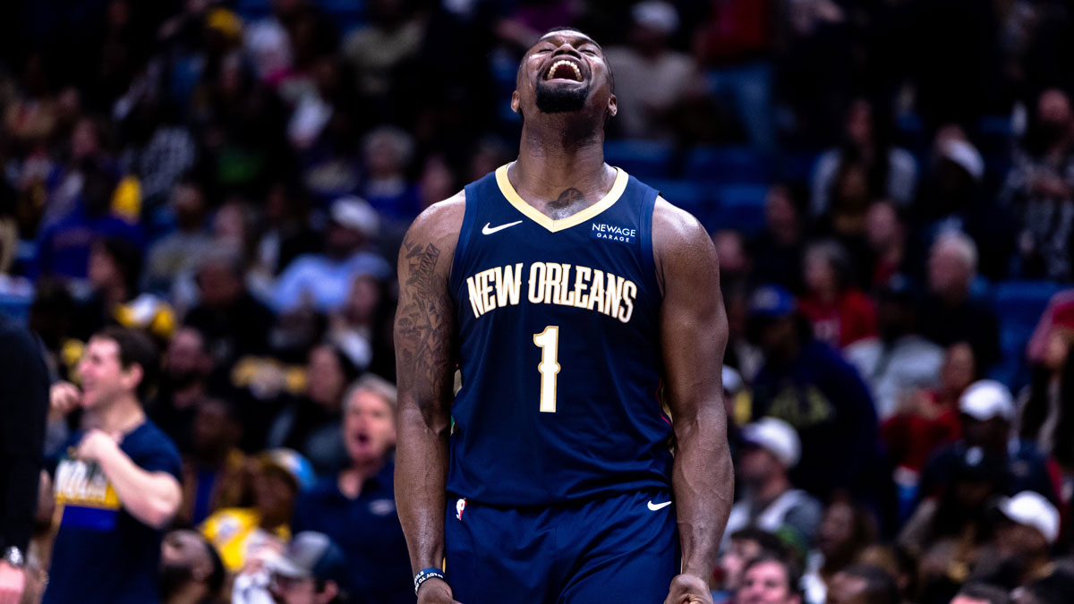 New Orleans Pelicans forward Zion Williamson (1) reacts to dunk the ball through the arm of Utah Jazz forward Drew Eubanks (15) during the second half at the Smoothie King Center.