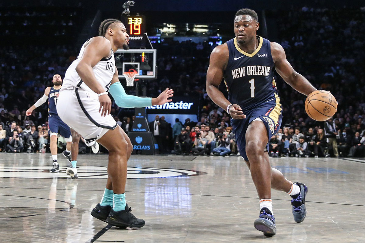 New Orleans Pelicans forward Zion Williamson (1) looks to drive past Brooklyn Nets guard Dennis Smith Jr. (4) in the second quarter at Barclays Center.