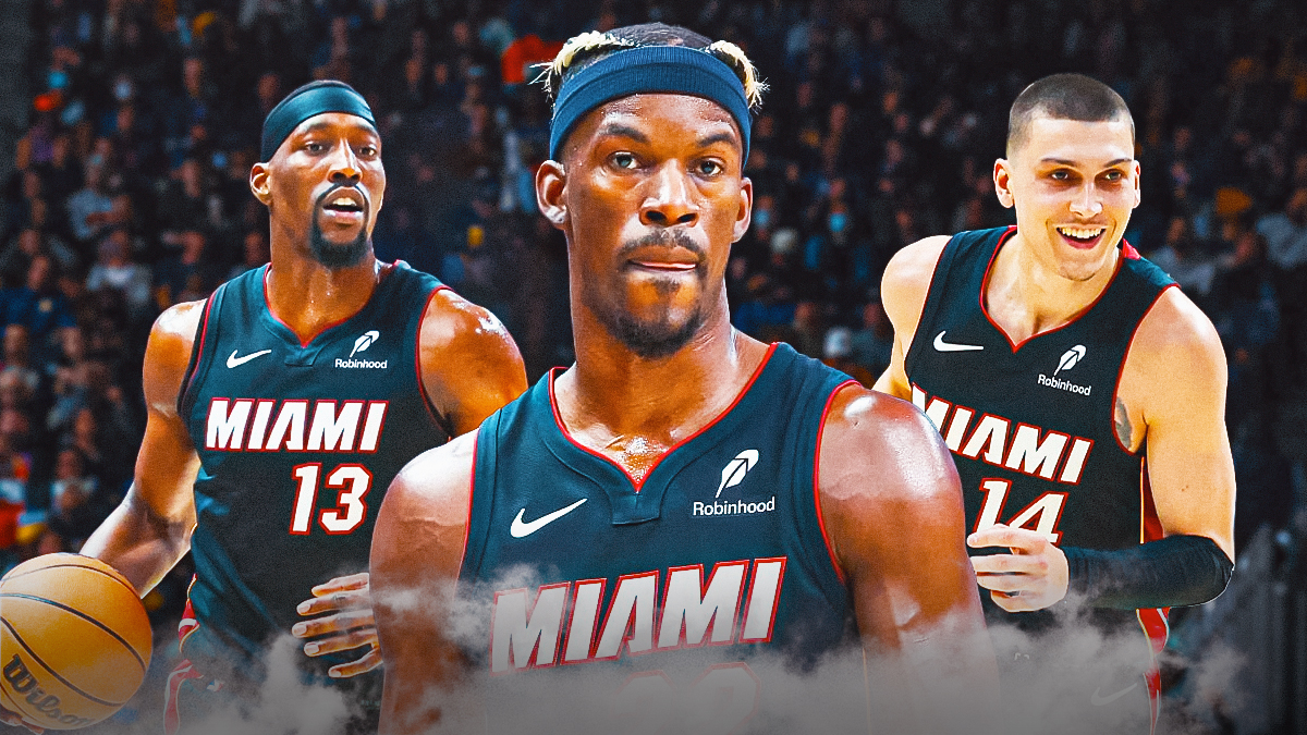 Miami Heat star Jimmy Butler in the middle with Tyler Herro and Bam Adebayo on either side in front of Kaseya Center.