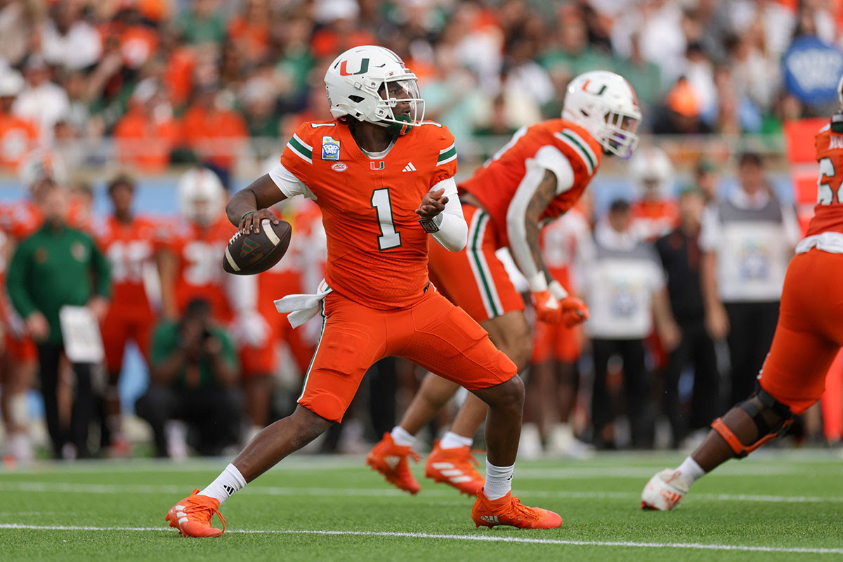 Hurricanes quarterback Cam Ward (1) drops back to pass against the Iowa State Cyclones in the first quarter during the Pop Tarts bowl at Camping World Stadium.