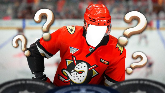 One silhouetted player in an Anaheim Ducks jersey (no C or A), Anaheim Ducks logo, 3-5 question marks, hockey rink in background