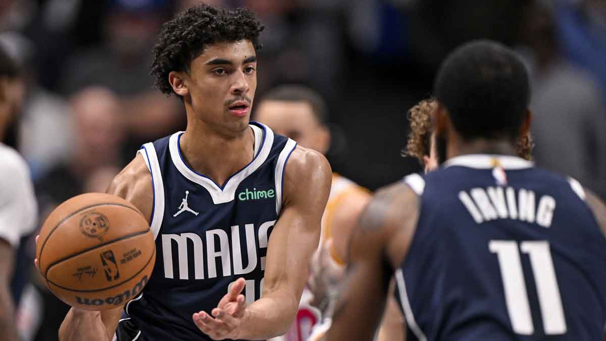 Dallas Mavericks guard Max Christie (00) and guard Kyrie Irving (11) in action during the game between the Dallas Mavericks and the Golden State Warriors at the American Airlines Center.