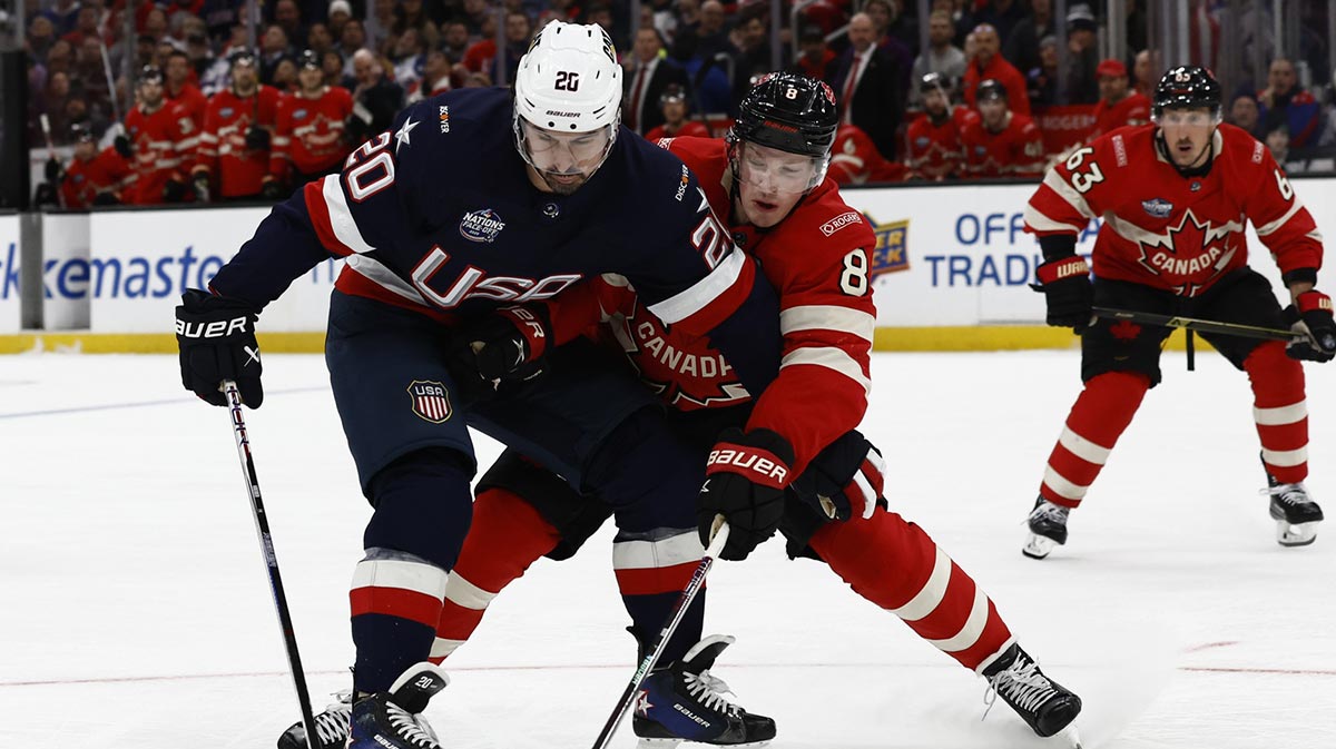 Team USA forward Chris Kreider (20) holds back Team Canada defenseman Cale Makar (8) during the third period during the 4 Nations Face-Off ice hockey championship game at TD Garden.