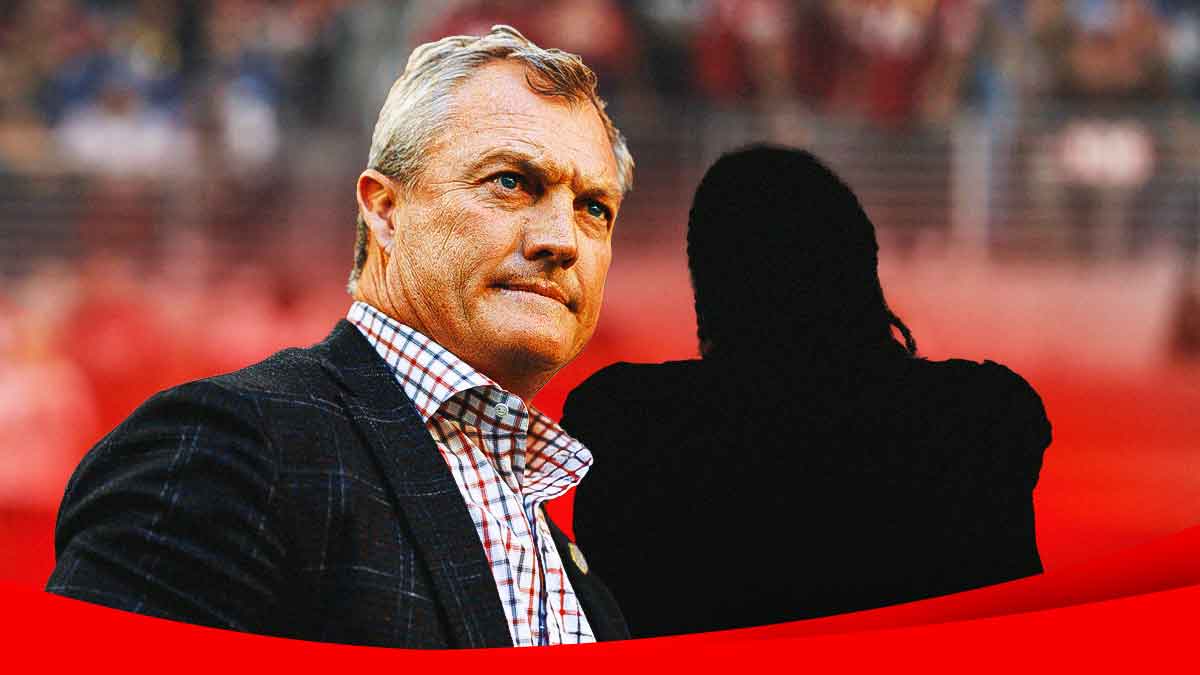 John Lynch next to the blacked-out silhouette of Najee Harris in front of the 49ers stadium.