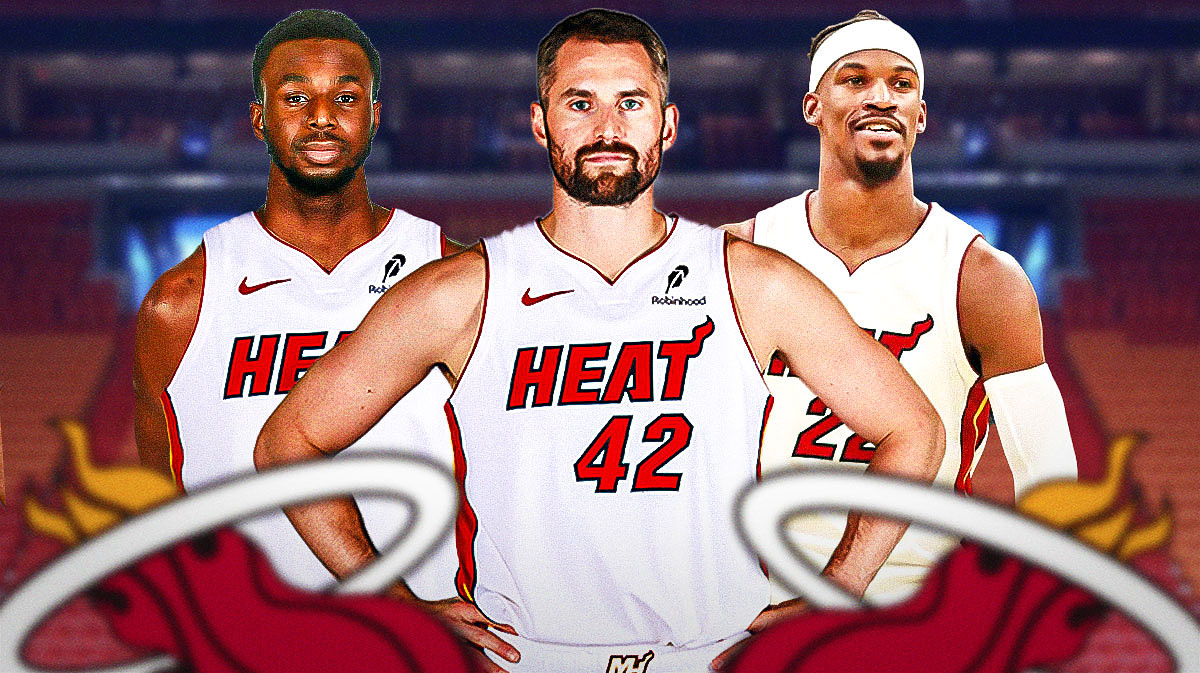 Miami Heat star Kevin Love in the middle with Jimmy Butler and Andrew Wiggins on either side in front of Kaseya Center.