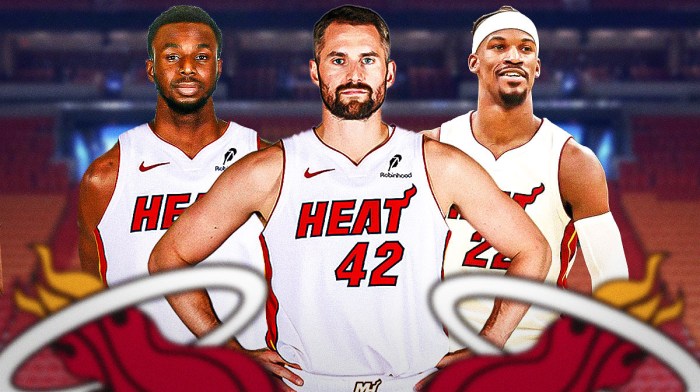 Miami Heat star Kevin Love in the middle with Jimmy Butler and Andrew Wiggins on either side in front of Kaseya Center.
