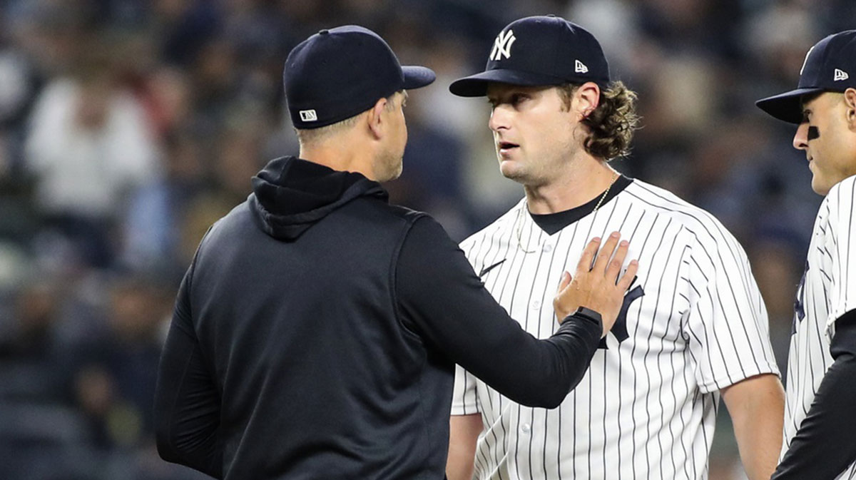  New York Yankees manager Aaron Boone (17) takes out starting pitcher Gerrit Cole (45) in the sixth inning against the Toronto Blue Jays at Yankee Stadium.