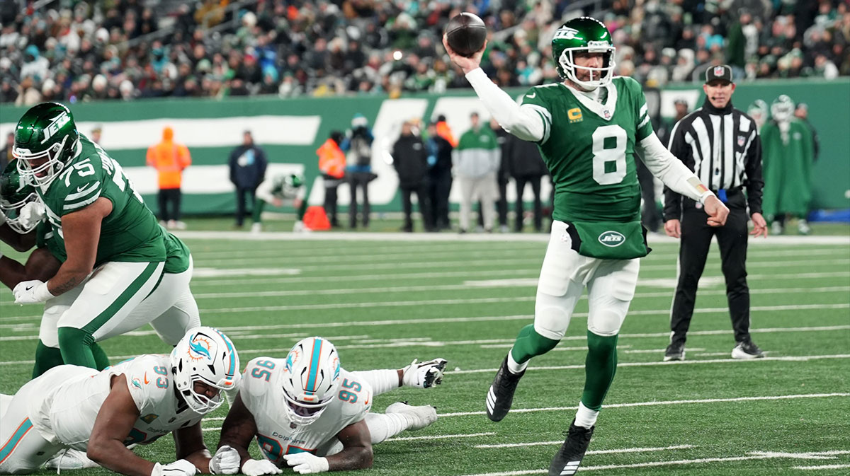 New York Jets quarterback Aaron Rodgers (8) throws his 500th career touchdown pass in the second quarter of the game against the Miami Dolphins on Jan. 5, 2025, in East Rutherford, N.J.