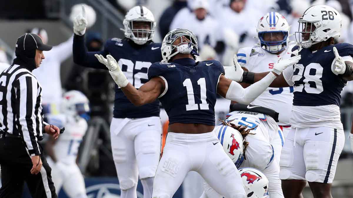 Dec 21, 2024; University Park, Pennsylvania, USA; Penn State Nittany Lions defensive end Abdul Carter (11) reacts after sacking Southern Methodist Mustangs quarterback Kevin Jennings (7) during the third quarter in the first round of the College Football Playoff at Beaver Stadium.