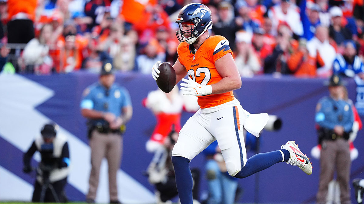 Denver Broncos tight end Adam Trautman (82) scores a touchdown against the Indianapolis Colts at Empower Field at Mile High.