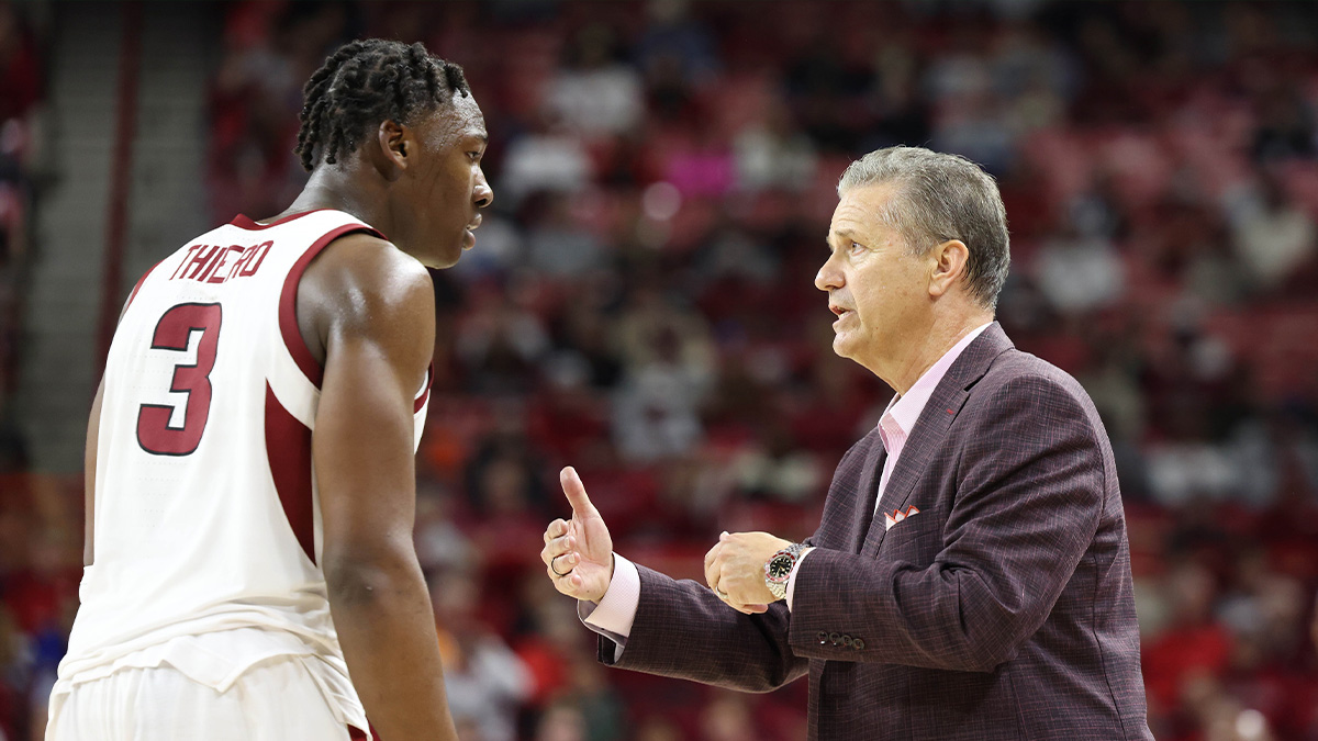 Arkansas Razorbacks head coach John Calipari talks to forward Adou Thiero (3) during the second half against the Little Rock Trojans at Bud Walton Arena. Arkansas won 79-67.