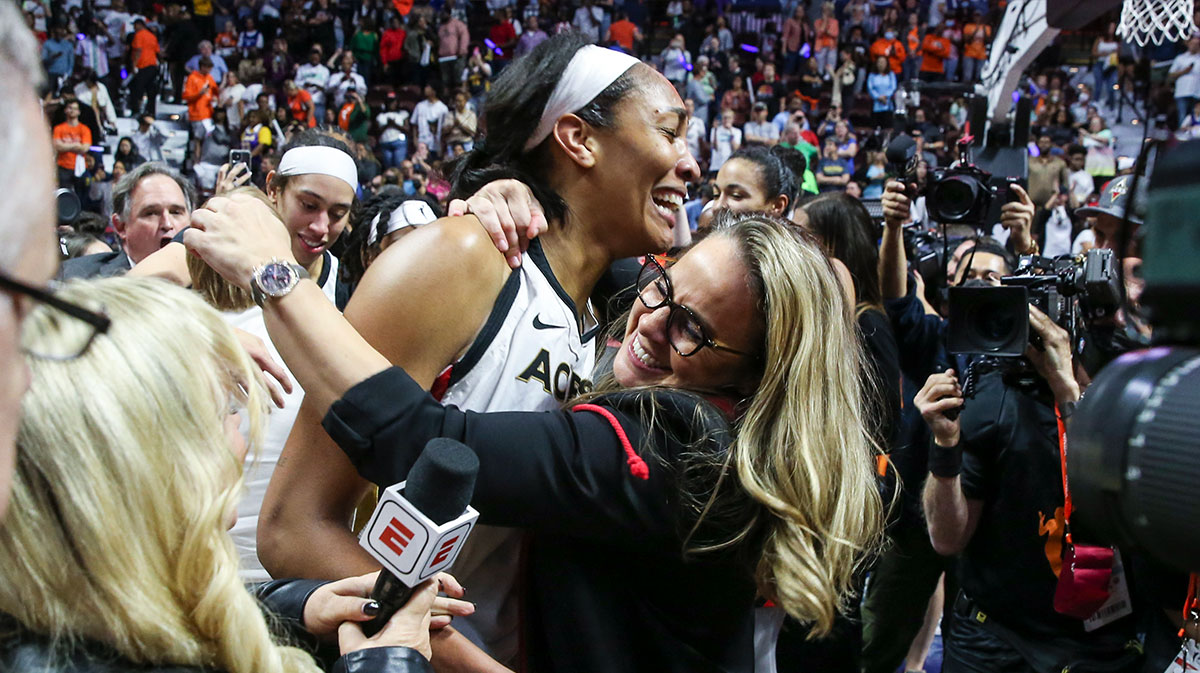 Las Vegas Aces forward A'ja Wilson (22) celebrates with head coach Becky Hammond after winning the WNBA Championship in game four of the 2022 WNBA Finals against the Connecticut Sun at Mohegan Sun Arena.