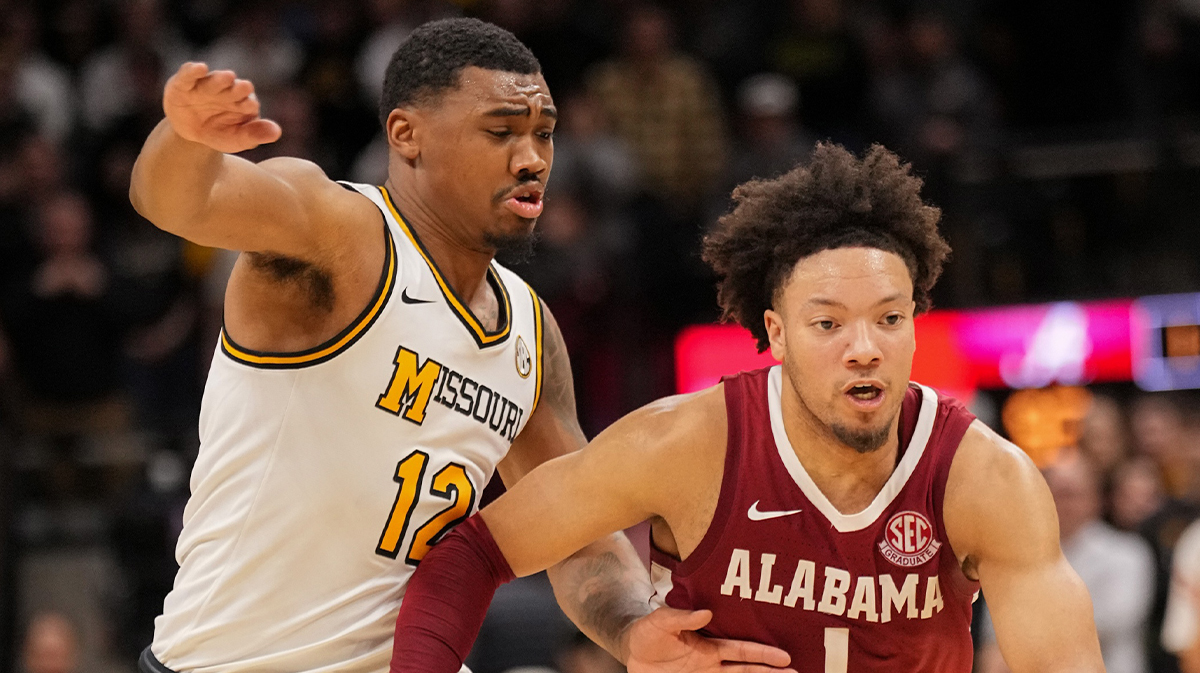 Alabama Crimson Tide guard Mark Sears (1) dribbles the ball as Missouri Tigers guard Tony Perkins (12) defends during the second half at Mizzou Arena. 