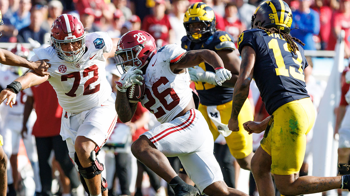 Alabama Crimson Tide running back Jam Miller (26) rushes with the ball against the Michigan Wolverines during the second half at Raymond James Stadium.